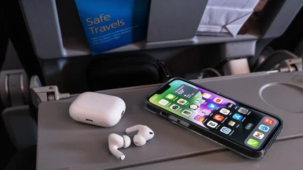 a_cell_phone_and_apple_airpods_pro_on_a_table