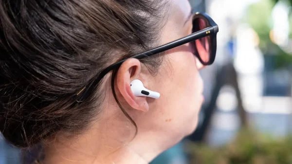 a_woman_wearing_a_pair_of_apple_airpods_pro